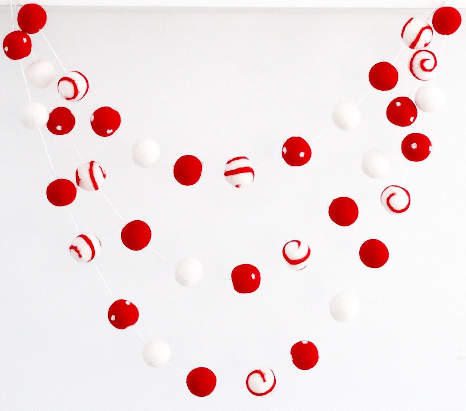 "Peppermint Swirl" Christmas Felt Ball Garland by Sheep Farm Felt- Red White Swirls and Dots Felt Balls. 9ft garland shown. 2.5 cm balls.